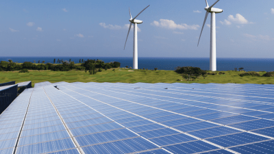 Solar panels in front of three windmills