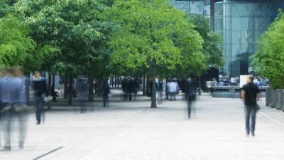 People walking to and from an office building