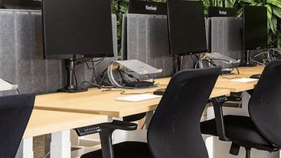 Office chairs in front of computers