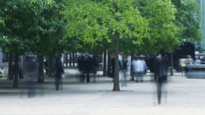 People walking to and from an office building